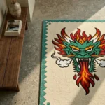 Perspective view of the Firebreath Dragon Head rug styled in a sunlit modern entryway, resting beautifully on a light terrazzo floor next to a sleek wooden bench.