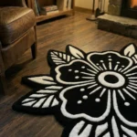 Close-up top-down view of the Obsidian Bloom rug, highlighting the dense hand-tufted wool pile and the crisp 3D carving of the stark white floral petals and dot work against the solid black background.