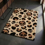 Perspective view of the rectangular Savage Skull Leopard rug styled on a dark slate floor, featuring a tan background with a unique leopard print pattern made of brown and black skulls and spots.