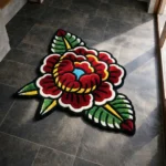 Close-up macro detail of the Traditional Peony rug, highlighting the totally dense texture of the hand-tufted New Zealand wool and the deep 3D carving around the yellow center and red petals.
