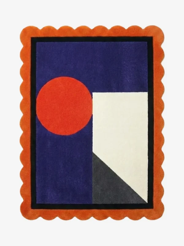 Top down view of the Amber Solis rug featuring a radiant sun-inspired geometric design in warm amber and golden yellow wool, finished with custom scalloped edges.