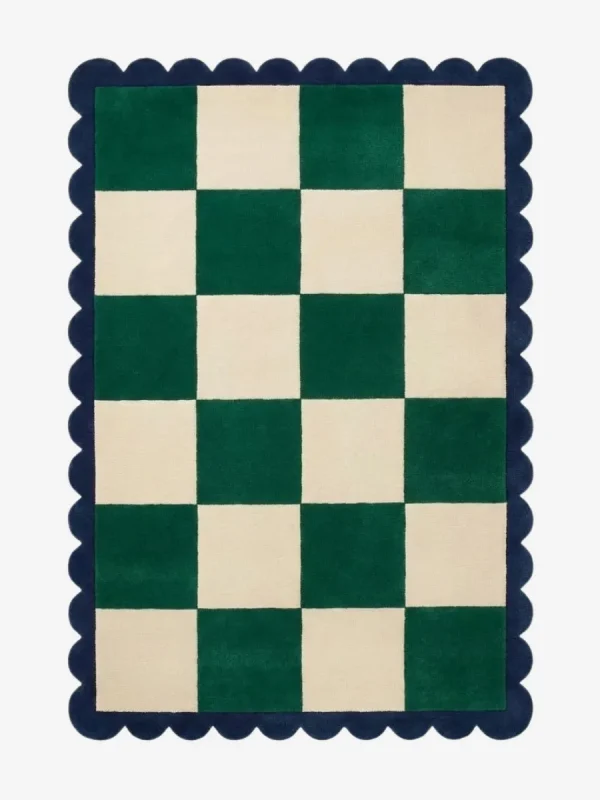 Top down view of the Arcet Offset rug featuring a playful checkered pattern with shifted blocks and curved "arc" details in high-quality wool, finished with custom scalloped edges.