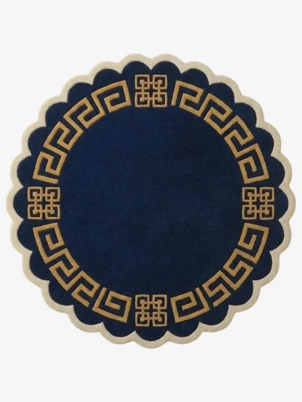 A top-down flat lay view of the entire round Aurexion Loop rug against a grey studio background, showcasing its complete circular shape, the thick abstract charcoal grey continuous loop pattern on a cream field, and the charcoal scalloped edge.