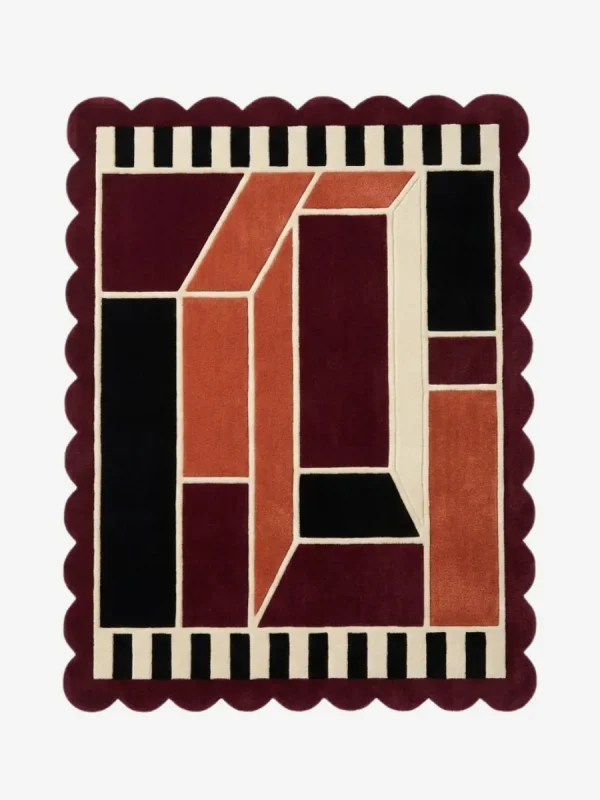 Top down view of the Burnt Frame rug featuring a neutral wool center framed by a rich burnt orange and brown border, finished with custom scalloped edges.