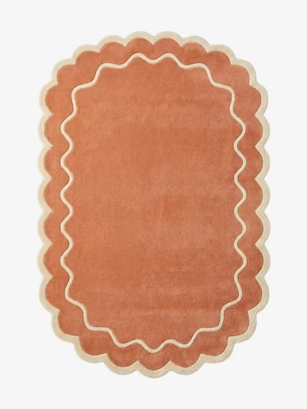 Top down view of the Cedar Patio rug featuring a warm rust terracotta background with a decorative cream wavy contour line and scalloped edges.