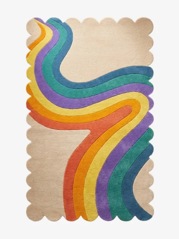Top down view of the Chromatic Wave rug featuring a beige background with a flowing retro rainbow ribbon design in yellow orange purple and blue.