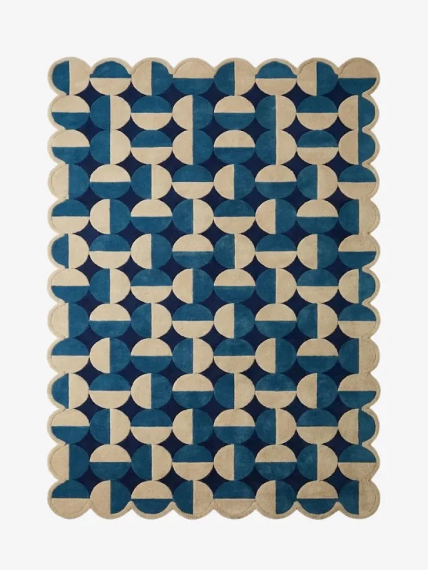 Top down flat lay of the Coastal Mosaic hand tufted rug showing the full repeating pattern of alternating blue and cream geometric shapes.