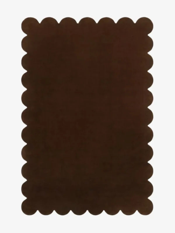 Top down view of the dark brown Cocoa Earth hand tufted wool rug showing the rectangular shape and scalloped edges. | Scalloped Rugs