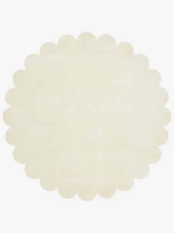 Top down view of the circular Cream Halo off white hand tufted wool rug on a white background showing the soft scalloped border.