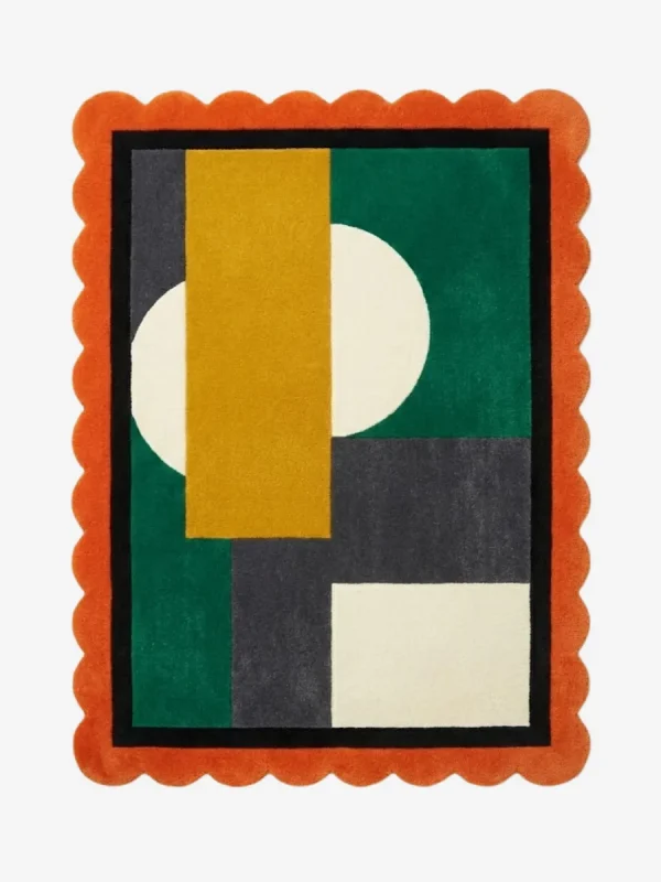 Top down view of the Dark Solis rug featuring a dramatic sun-burst design in deep charcoal and black wool with contrasting accents, finished with custom scalloped edges.