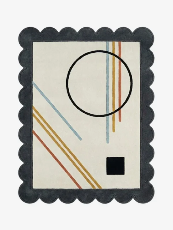 Top down view of the Incorix rug featuring a sophisticated modern geometric pattern with clean lines in high-quality wool, finished with custom scalloped edges.