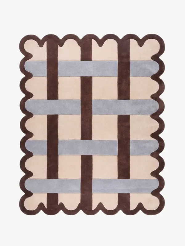 Top down view of the Linen Blend rug featuring a cream wool background with an interlaced grid pattern of dark brown and light grey stripes, framed by a dark brown scalloped border.