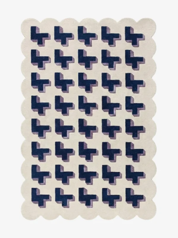 Top-down view of the Midnight Surge rug against a white background, featuring a repeating 3D geometric pattern of dark blue crosses with lavender shadows on a solid cream background, framed by a continuous cream scalloped border.
