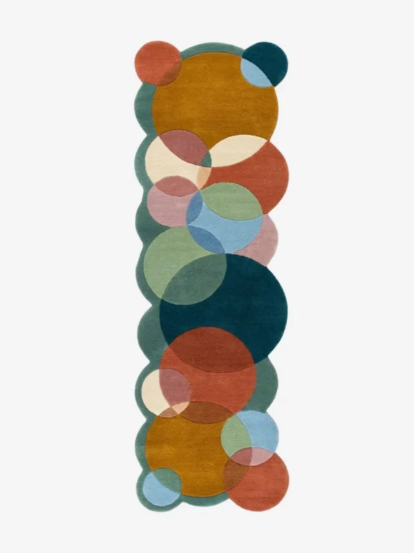 Top down view of the Ochre Orbit runner rug on a white background, featuring a modern geometric pattern of interlocking colorful circles with custom shaped scalloped edges.