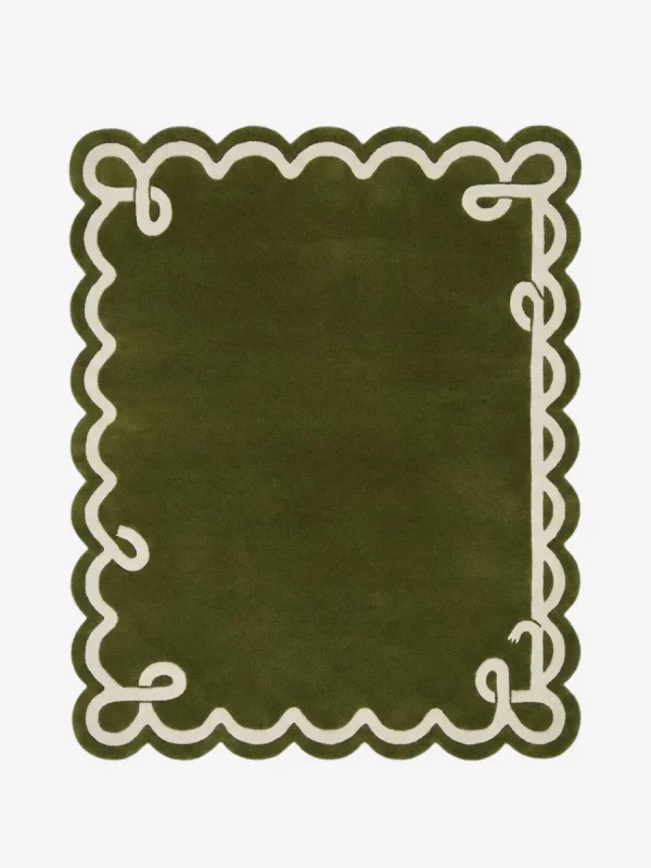 Top down view of the Olive Reverie rug featuring a deep olive green wool background with a decorative cream ribbon border design and elegant custom scalloped edges.