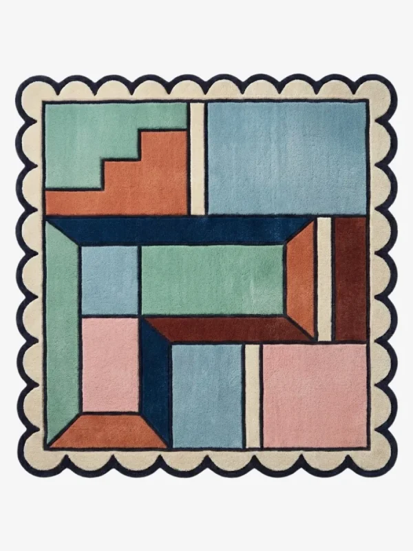 Top down view of the Pastel Pocket Square rug featuring a geometric color block design in mint green, light blue, pink, and rust, framed by a cream scalloped border.