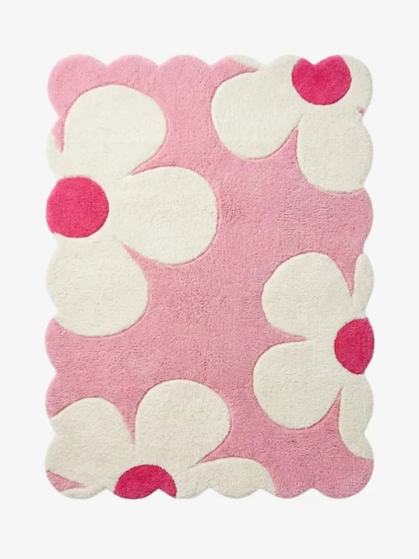 Top down view of the Petal Puff rug featuring a soft pink background with large white cloud like flower shapes and vibrant hot pink centers.