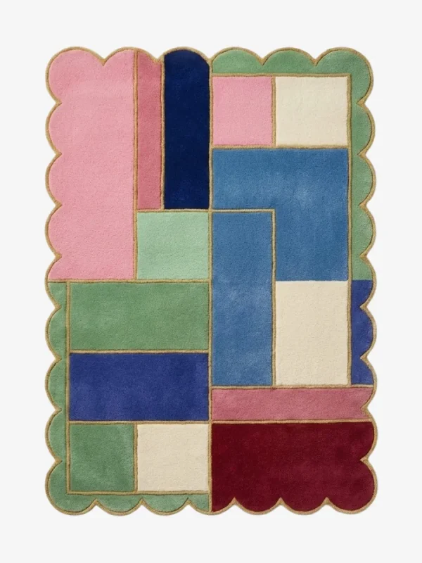 Top down view of the Piatched Poise rug featuring a dynamic, multi-colored geometric block design that mixes pastel shades with deep jewel tones, completely surrounded by a decorative scalloped border.