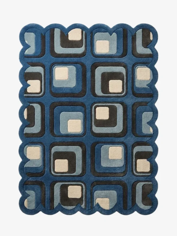 Top down view of the Retrose Orchid rug featuring a vibrant retro grid design of nested rounded squares in navy, light blue, grey, and cream, completely surrounded by a continuous blue scalloped border.