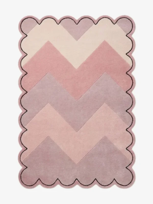 Top-down view of the Rose Chevron rug featuring a gradient zigzag pattern in shades of cream, soft blush, rose, and mauve, framed by a continuous scalloped border with a thin black outline.