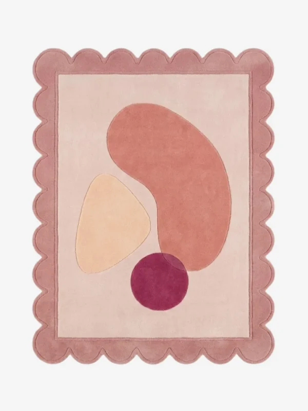 Top down view of the Rose Veil rug featuring a romantic, ethereal design with layers of soft rose pink and sheer white accents, finished with custom scalloped edges.