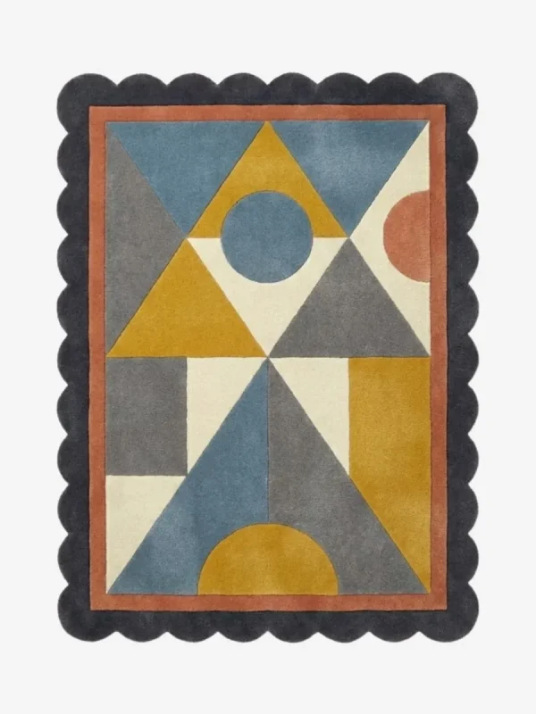 Top down view of the Saffron Drift rug featuring a warm saffron yellow and geometric pattern that creates a sense of movement, finished with custom scalloped edges.