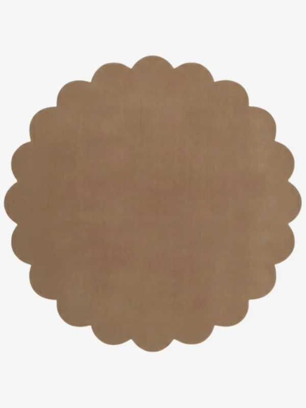 Top down view of the circular Sandstone taupe brown hand tufted wool rug on a white background showing the scalloped border.