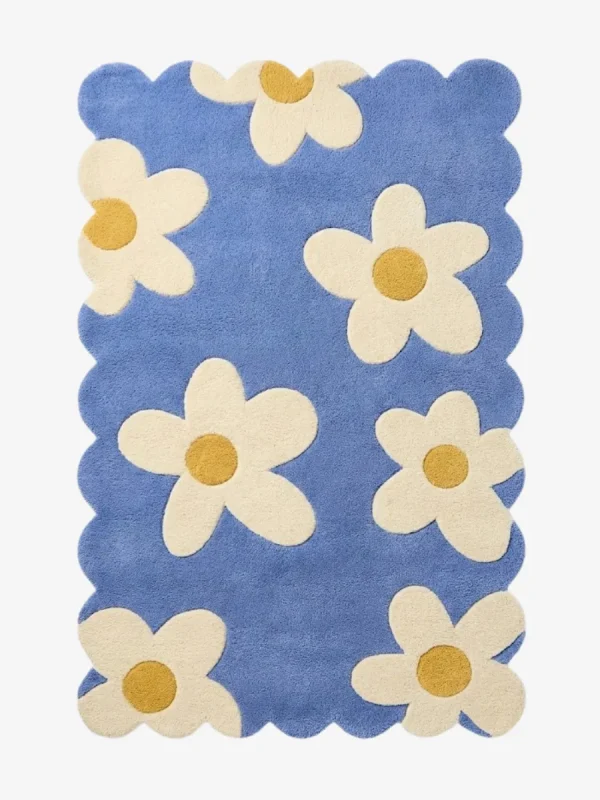 Top down view of the Sea Tonic rug featuring a fresh blue background with large white daisy motifs and yellow centers.