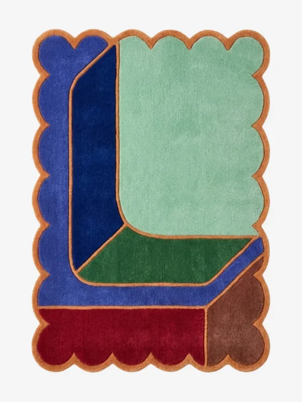 Top down view of the Soft Lagoon rug featuring a calming teal green wool background with a delicate geometric grid pattern and custom scalloped edges.