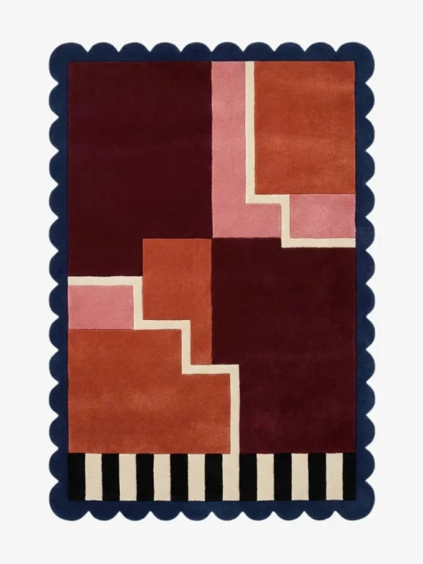 Top down view of the Stepped Field rug featuring a rhythmic geometric step pattern in earthy field tones on a plush wool background, finished with custom scalloped edges.