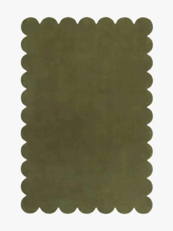 Top down flat lay view of the Stone Whisper rug featuring a solid earthy olive green color and decorative scalloped borders isolated on a white background.