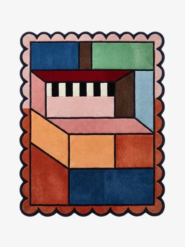 Top down view of the Studio Block rug featuring a bold geometric block pattern in modern contrasting tones on a high-quality wool background, finished with custom scalloped edges.