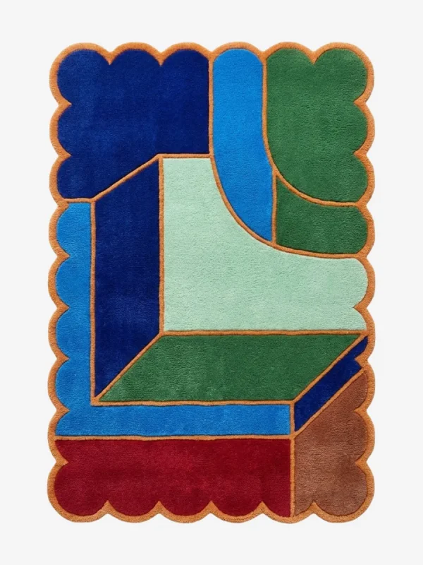 Top down view of the Sunroom Courtyard rug featuring a vibrant geometric pattern reminiscent of sunny courtyard tiles in shades of yellow, cream, and terracotta, finished with a custom scalloped edge.