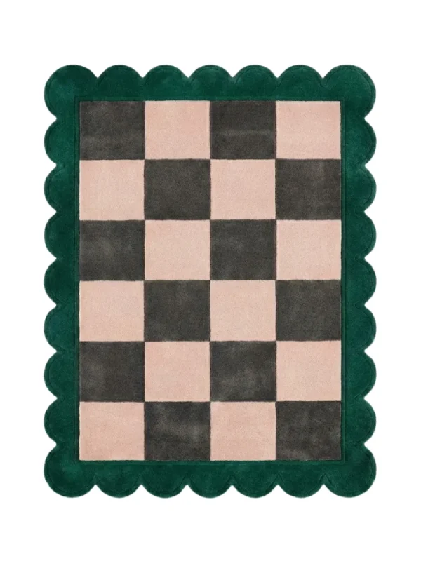 Top down view of the Verda Current rug featuring a deep green wool background with a fluid, wavy line pattern resembling a flowing river current, finished with custom scalloped edges.